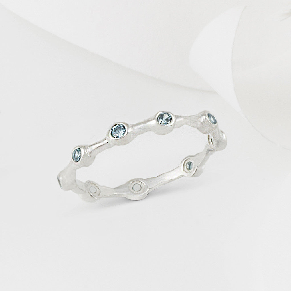Aura Blue Topaz and Silver Eternity Ring Band